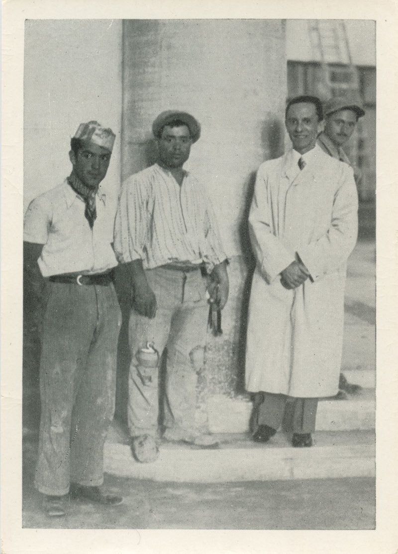 A group of men standing next to each other.