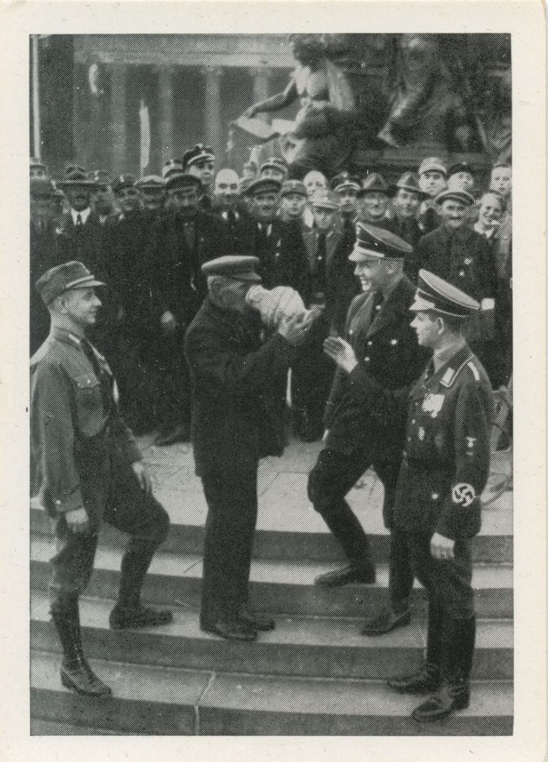 A group of men standing around each other.
