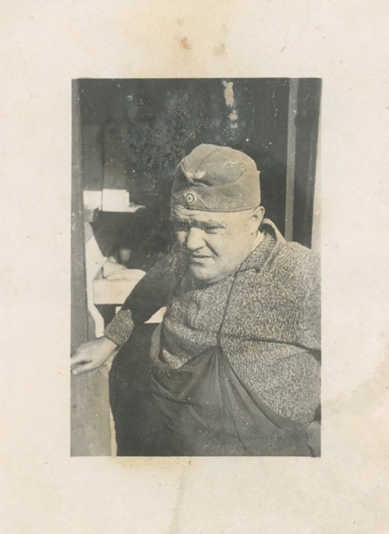 A man in an old photo wearing a hat.
