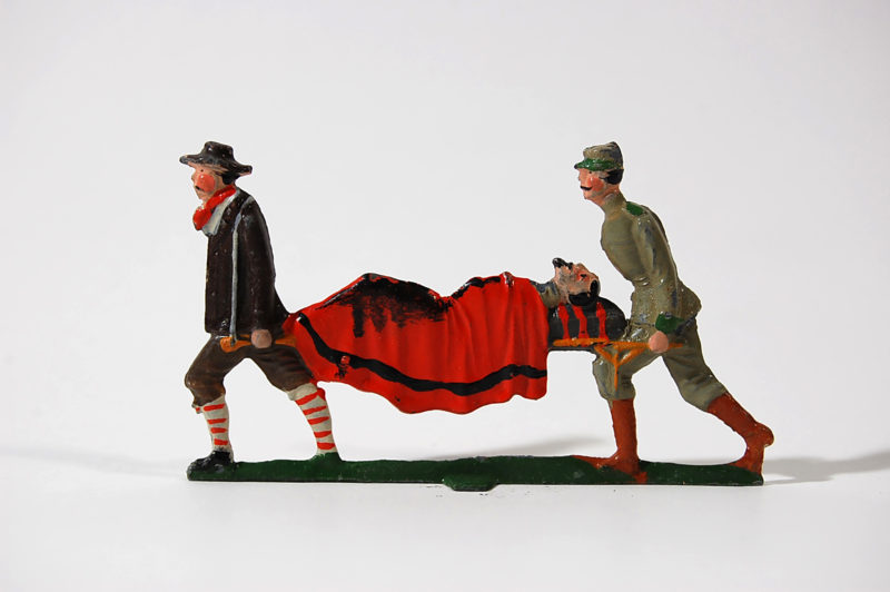 A toy of two men carrying a dead body.