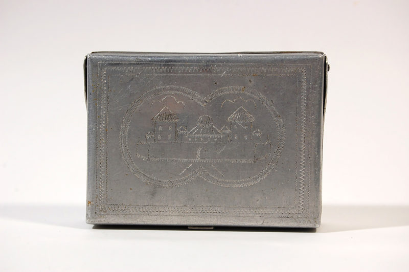 A box that is sitting on the ground.