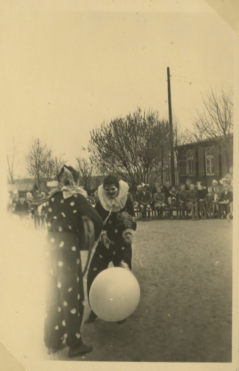 A group of people standing around in front of a crowd.