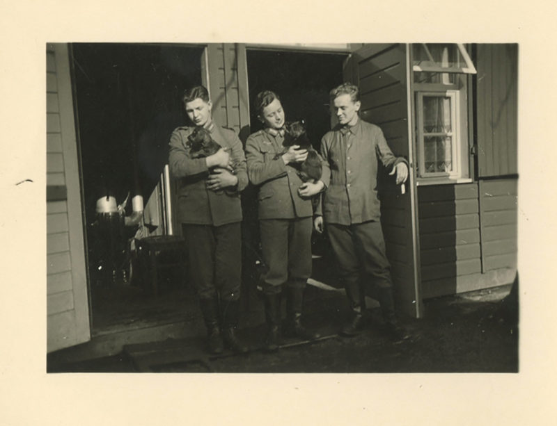 Three men in uniform standing next to each other.