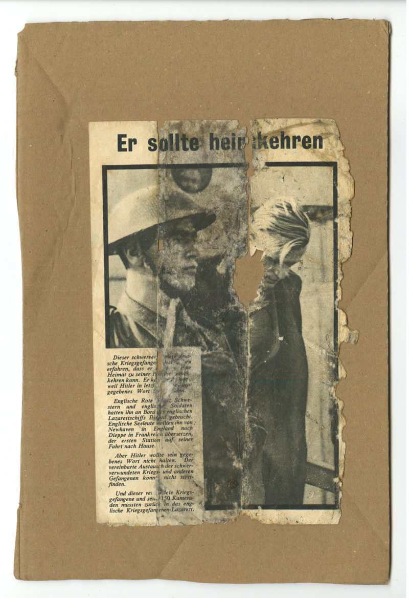 A newspaper with an old photo of a man in a hat.