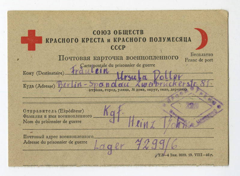 A red cross card with the name of a person.