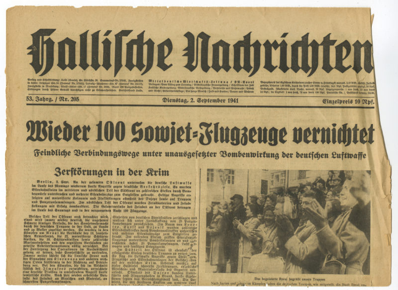 A newspaper with an article about the 1 0 0 th anniversary of the german occupation.