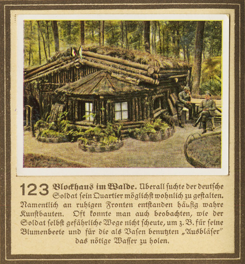 A picture of an old log cabin in the woods.