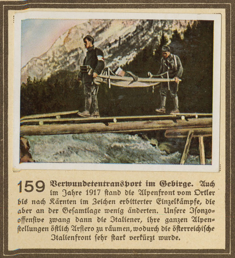 A picture of two men standing on top of a mountain.